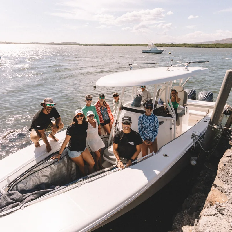 The group on the boat on their way out to the break